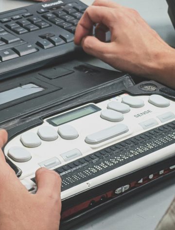 Person using a Braille Writer